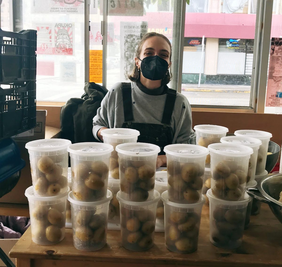 Volunteer helps out at Food Mutual Aid