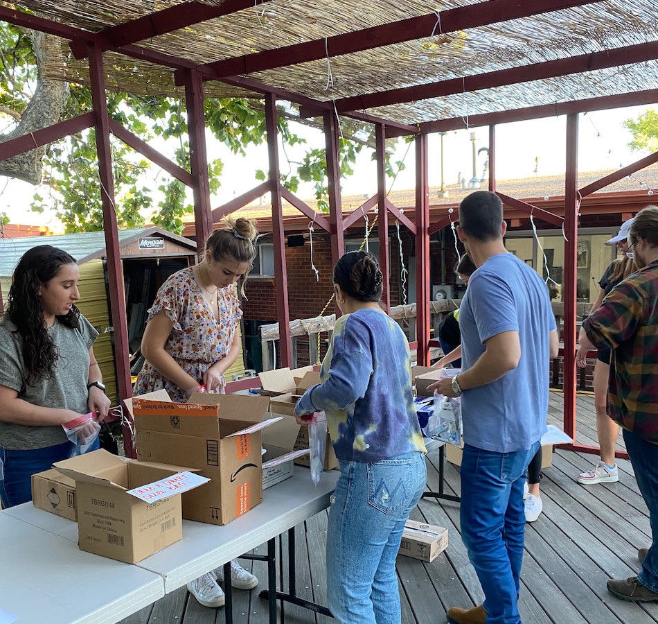 Volunteers packing hygiene kits