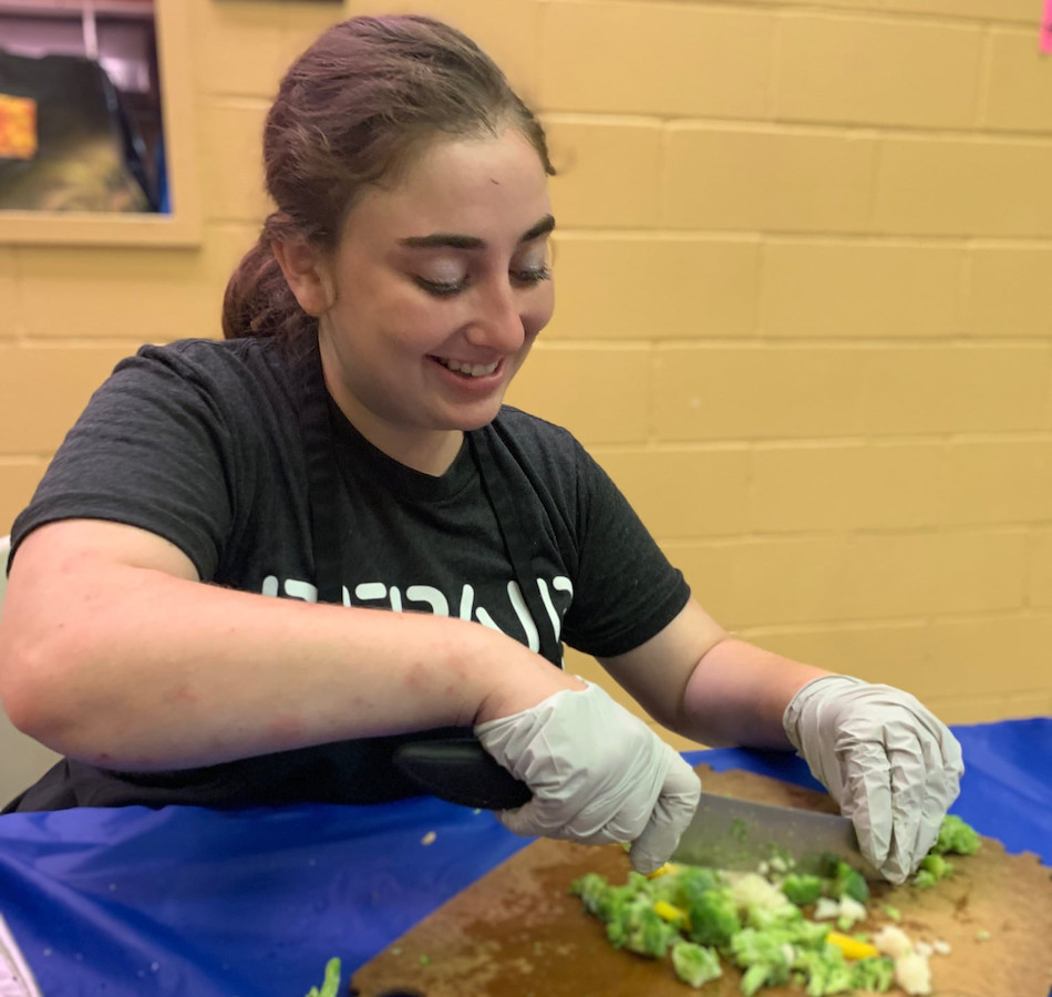 Former NY Fellow Ilana chops veggies at a Harlem soup kitchen.