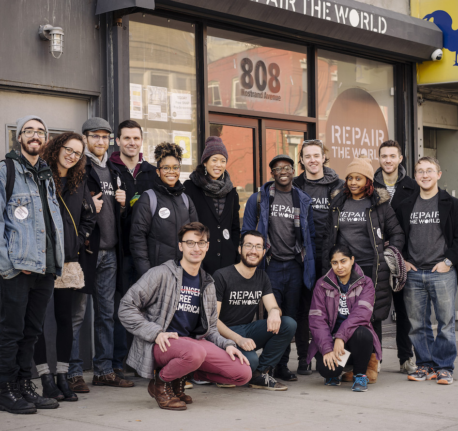 group of volunteers standing and smiling